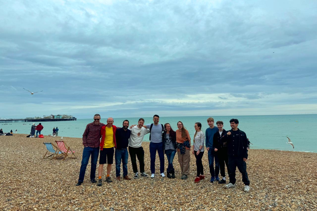 The alumni of March 2024 smiling. 